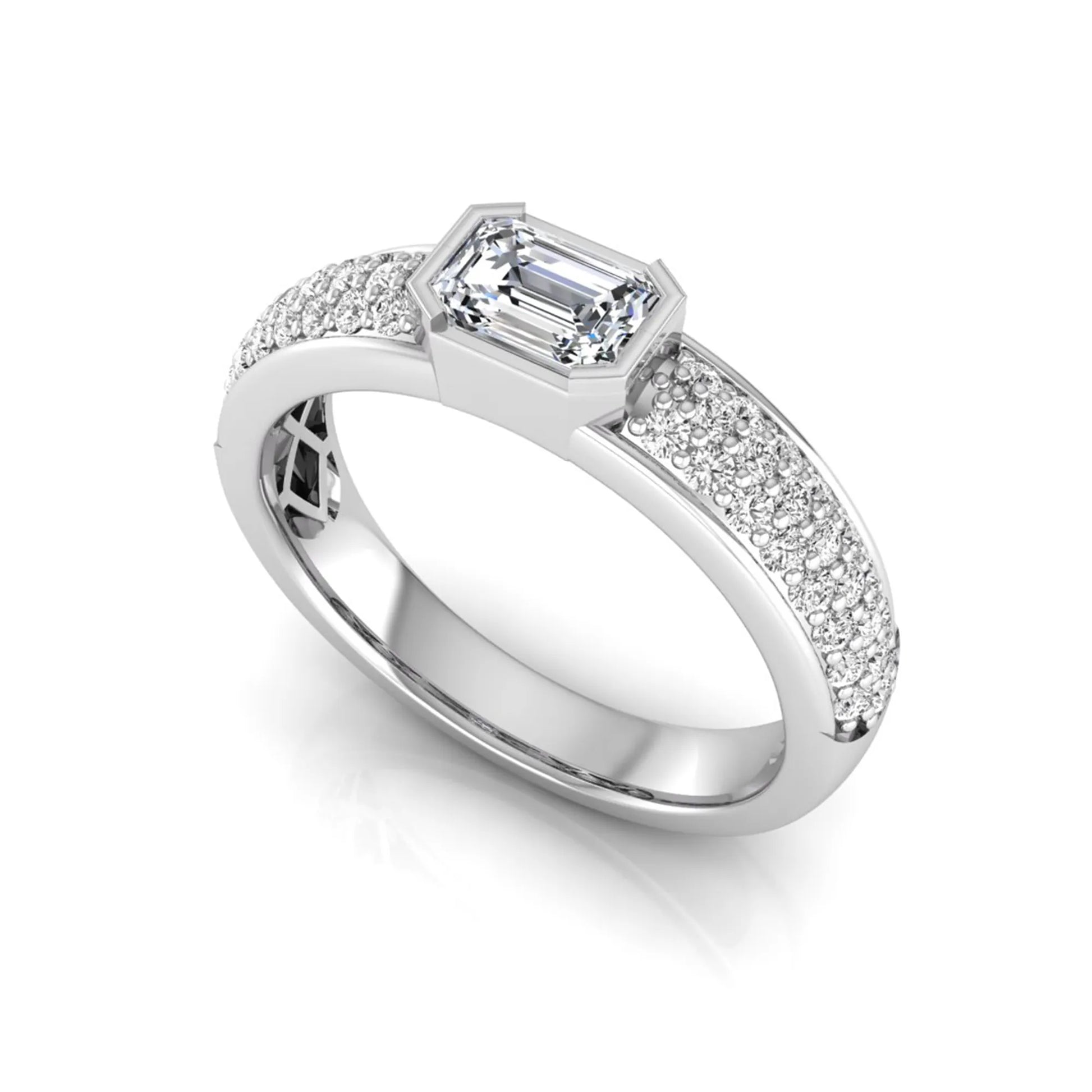 Bezel set emerald cut lab grown diamond engagement ring featuring a 0.52 carat emerald center diamond with pavé round diamond band in white gold.