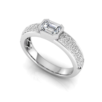 Bezel set emerald cut lab grown diamond engagement ring featuring a 0.52 carat emerald center diamond with pavé round diamond band in white gold.