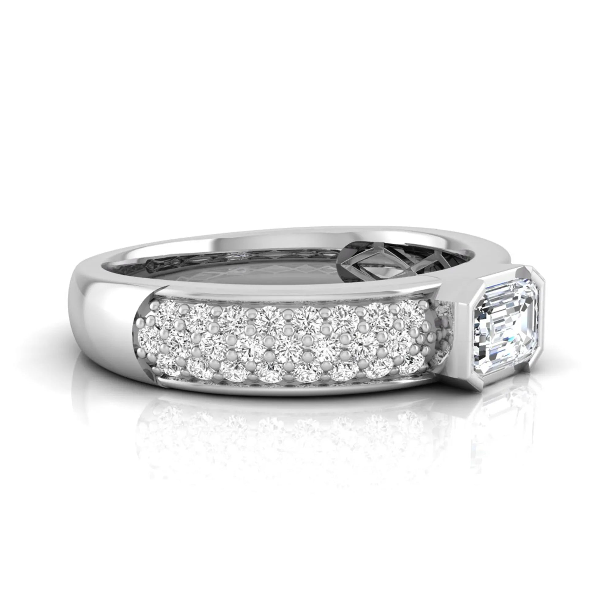 Bezel set emerald cut lab grown diamond engagement ring featuring a 0.52 carat emerald center diamond with pavé round diamond band in white gold.
