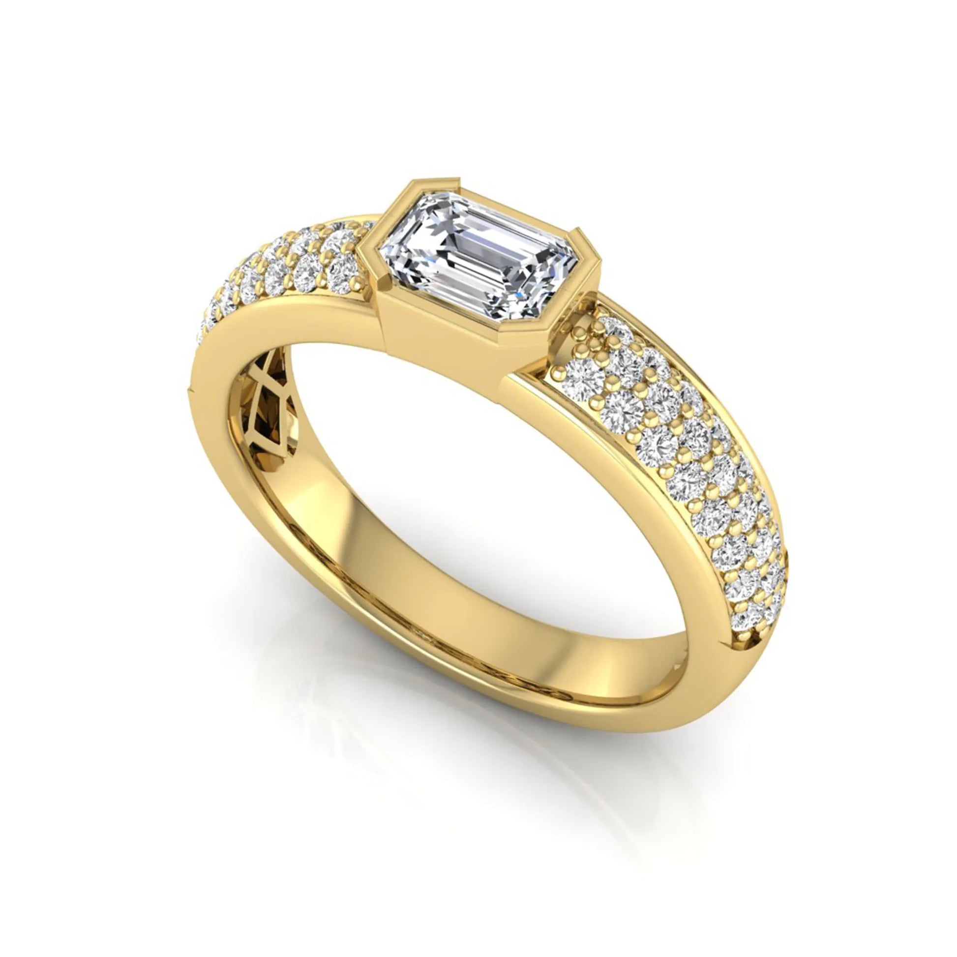 Bezel set emerald cut lab grown diamond engagement ring featuring a 0.52 carat emerald center diamond with pavé round diamond band in yellow gold.