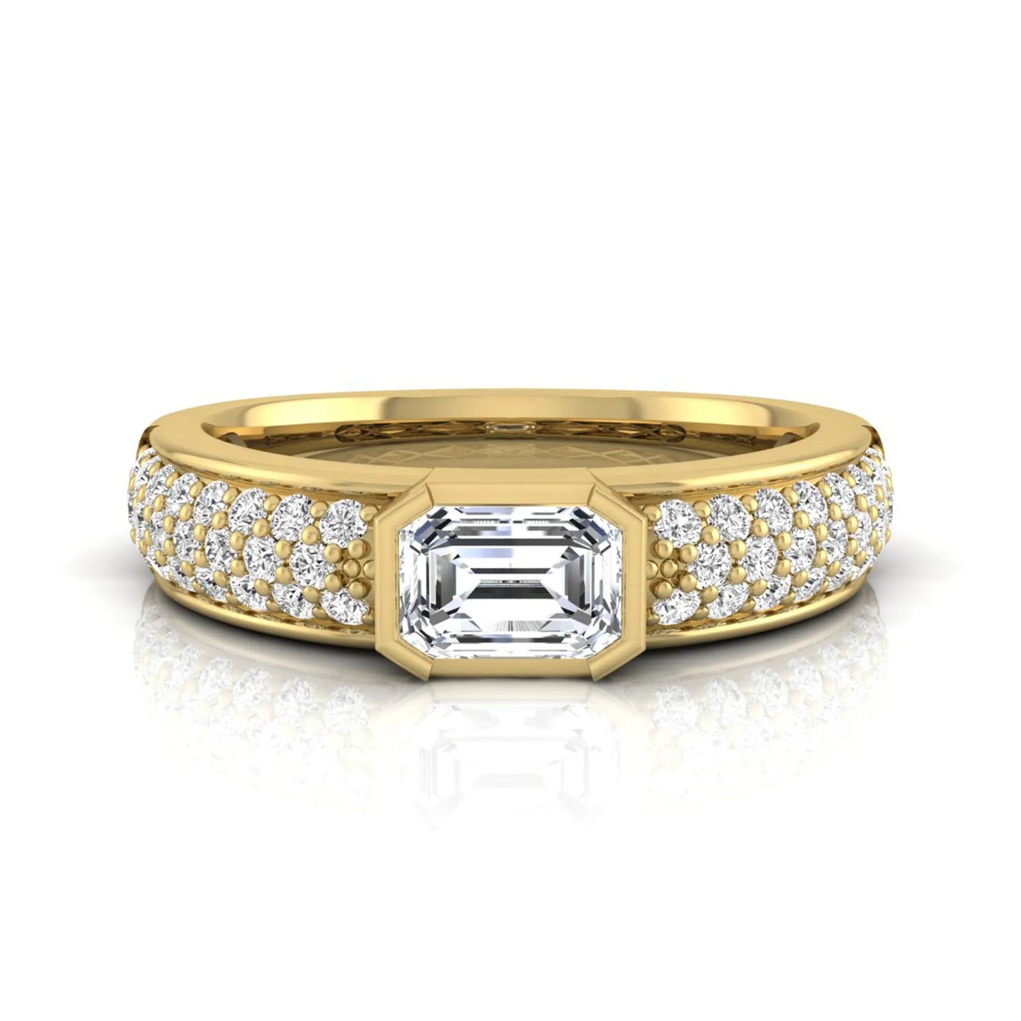 Bezel set emerald cut lab grown diamond engagement ring featuring a 0.52 carat emerald center diamond with pavé round diamond band in yellow gold.