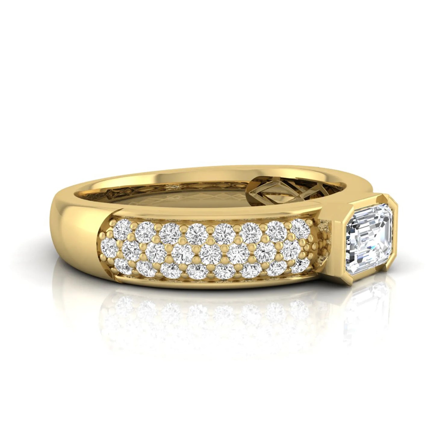Bezel set emerald cut lab grown diamond engagement ring featuring a 0.52 carat emerald center diamond with pavé round diamond band in yellow gold.