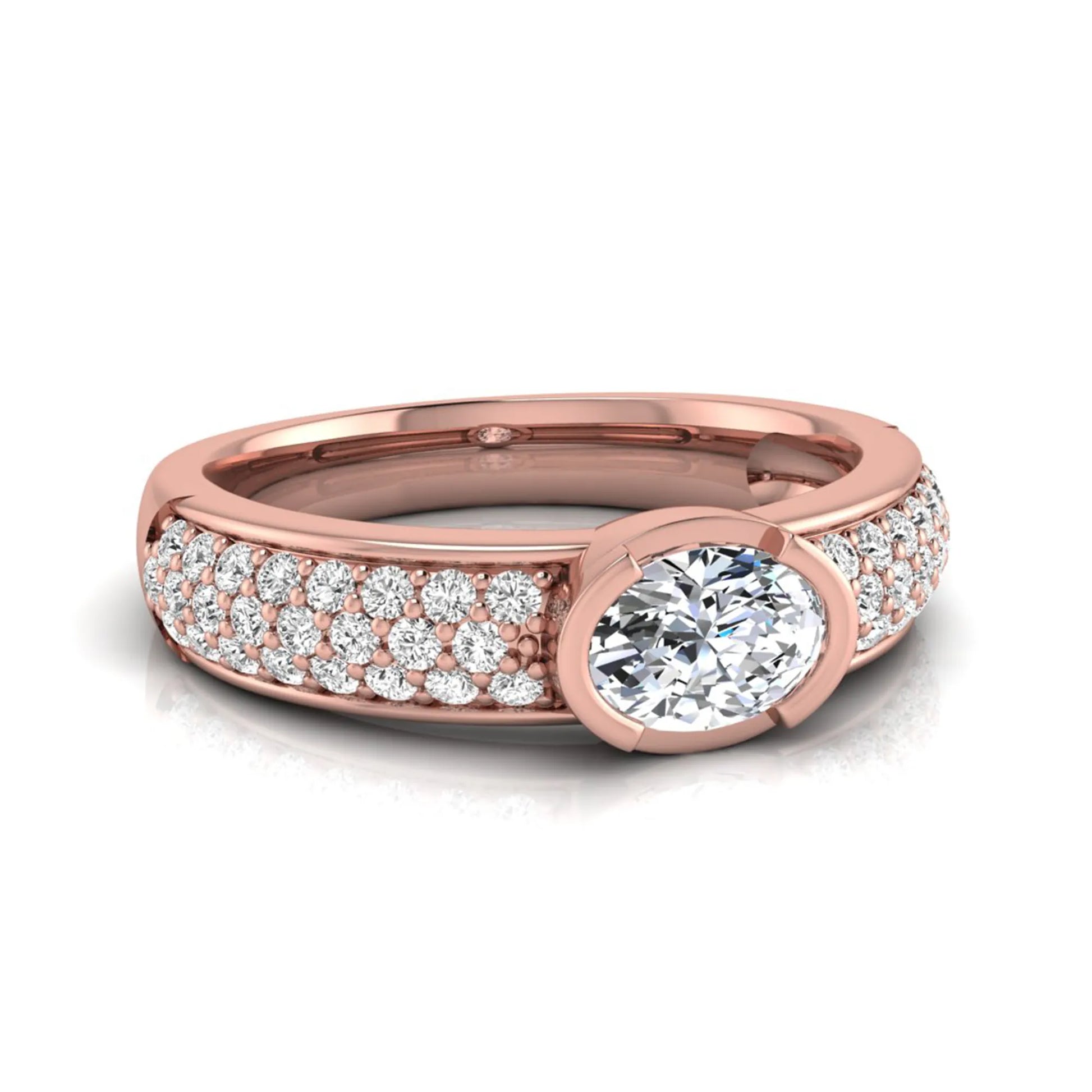 Bezel set oval lab grown diamond engagement ring featuring a 0.52 carat oval center diamond with pavé round diamond band in rose gold.