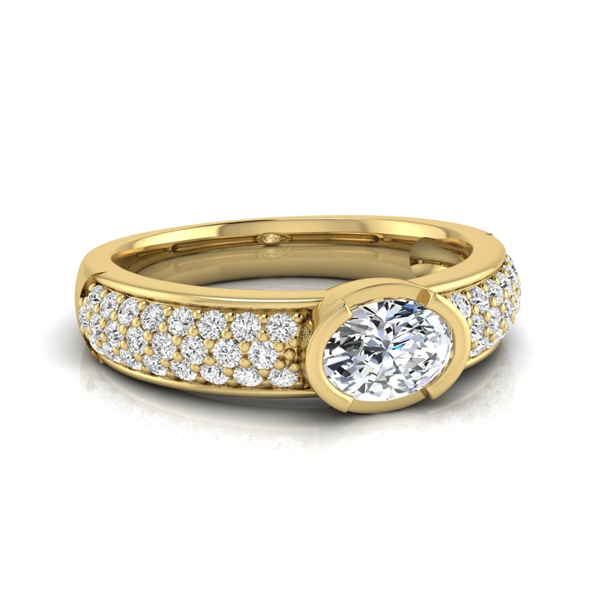 Bezel set oval lab grown diamond engagement ring featuring a 0.52 carat oval center diamond with pavé round diamond band in yellow gold.