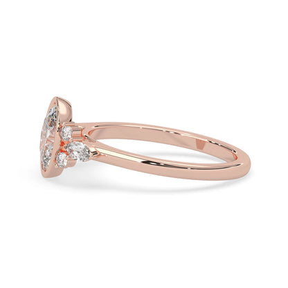 bezel set oval lab grown diamond seven stone floral engagement ring with marquise and round side diamonds in rose gold