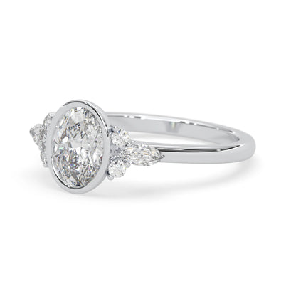 bezel set oval lab grown diamond seven stone floral engagement ring with marquise and round side diamonds in white gold
