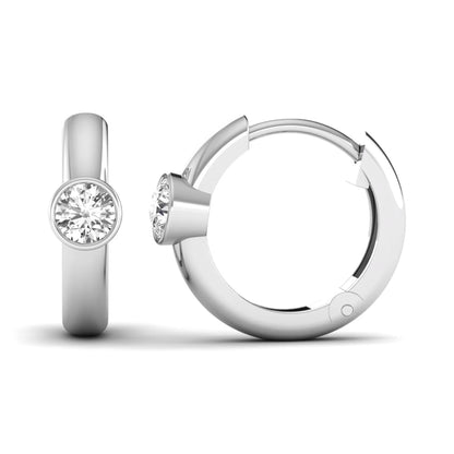 Bezel set round cut lab grown diamond huggie hoop earrings featuring a hinged snap closure and polished white gold design.