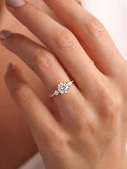 1.5 Carat Round Cut Three Stone Lab Grown Diamond Engagement Ring with Pear Side Stones