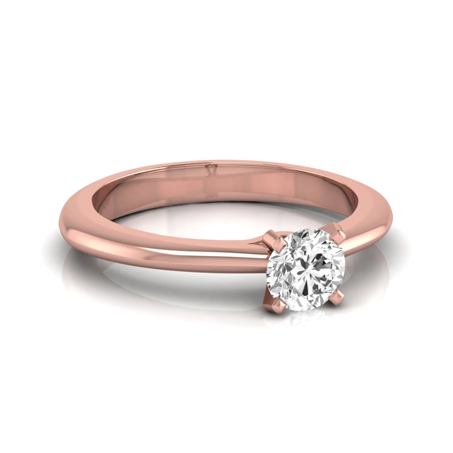 Classic round lab grown diamond solitaire engagement ring with a four-prong setting in rose gold.