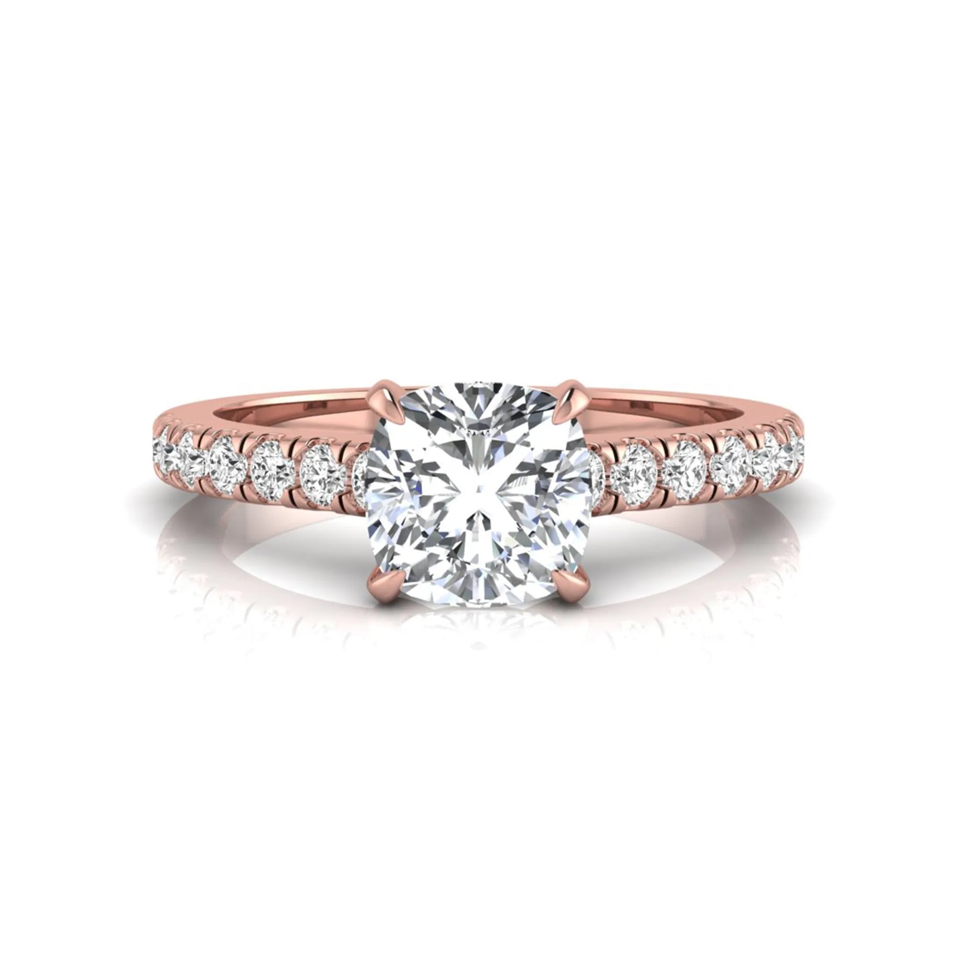 Cushion cut lab grown diamond engagement ring featuring a 1.03 carat center diamond in a four-prong setting with round accent diamonds on a rose gold design.