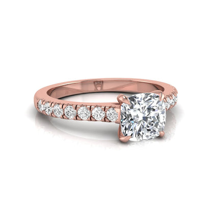 Cushion cut lab grown diamond engagement ring featuring a 1.03 carat center diamond in a four-prong setting with round accent diamonds on a rose gold design.