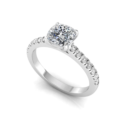 Cushion cut lab grown diamond engagement ring featuring a 1.03 carat center diamond in a four-prong setting with round accent diamonds on a white gold design.