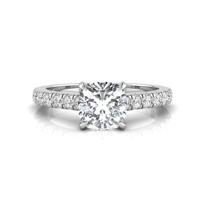Cushion cut lab grown diamond engagement ring featuring a 1.03 carat center diamond in a four-prong setting with round accent diamonds on a white gold design.