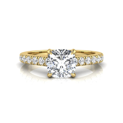 Cushion cut lab grown diamond engagement ring featuring a 1.03 carat center diamond in a four-prong setting with round accent diamonds on a yellow gold design.