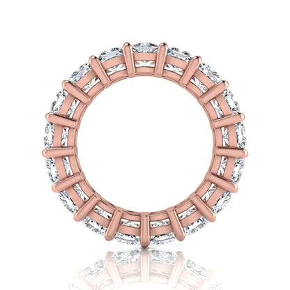 Cushion cut lab grown diamond eternity band ring featuring shared prong set diamonds with a rose gold tone design.