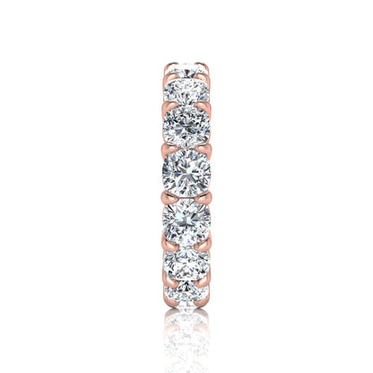 Cushion cut lab grown diamond eternity band ring featuring shared prong set diamonds with a rose gold tone design.