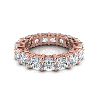 Cushion cut lab grown diamond eternity band ring featuring shared prong set diamonds with a rose gold tone design.