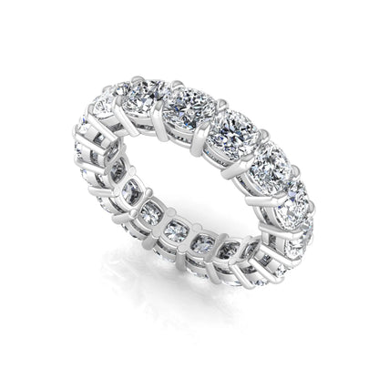 Cushion cut lab grown diamond eternity band ring featuring shared prong set diamonds with a white gold tone design.