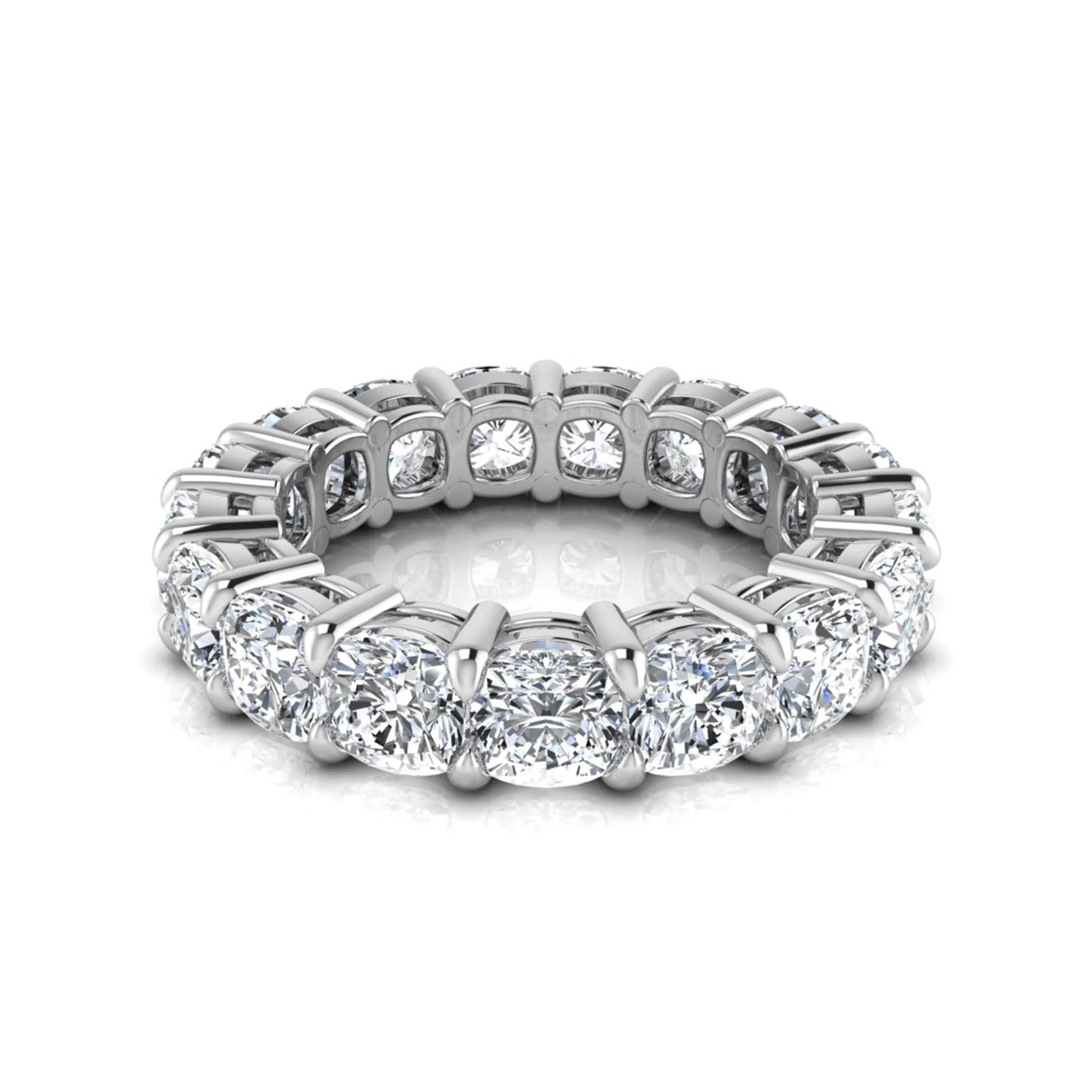 Cushion cut lab grown diamond eternity band ring featuring shared prong set diamonds with a white gold tone design.