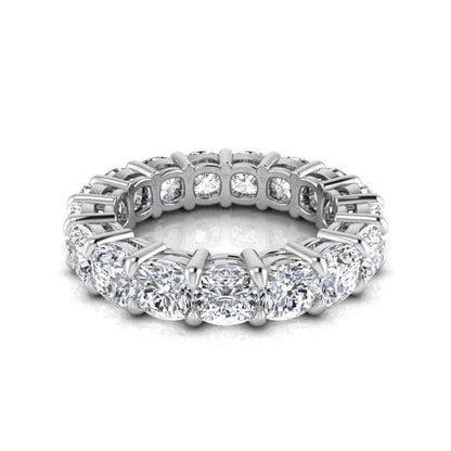 Cushion cut lab grown diamond eternity band ring featuring shared prong set diamonds with a white gold tone design.