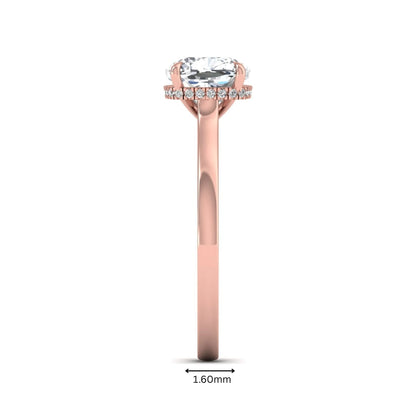 IGI certified cushion cut lab grown diamond hidden halo solitaire engagement ring in rose gold.