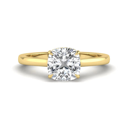 IGI certified cushion cut lab grown diamond hidden halo solitaire engagement ring in yellow gold.