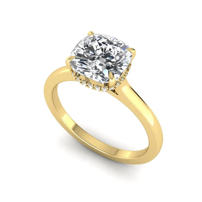 IGI certified cushion cut lab grown diamond hidden halo solitaire engagement ring in yellow gold.