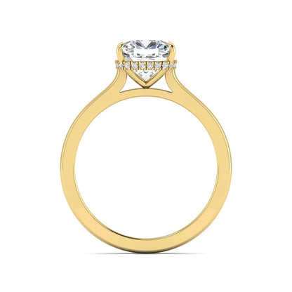 IGI certified cushion cut lab grown diamond hidden halo solitaire engagement ring in yellow gold.