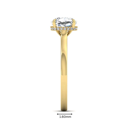 IGI certified cushion cut lab grown diamond hidden halo solitaire engagement ring in yellow gold.