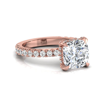Cushion cut lab grown diamond engagement ring featuring a four-prong setting with round pavé side diamonds and rose gold tone band.