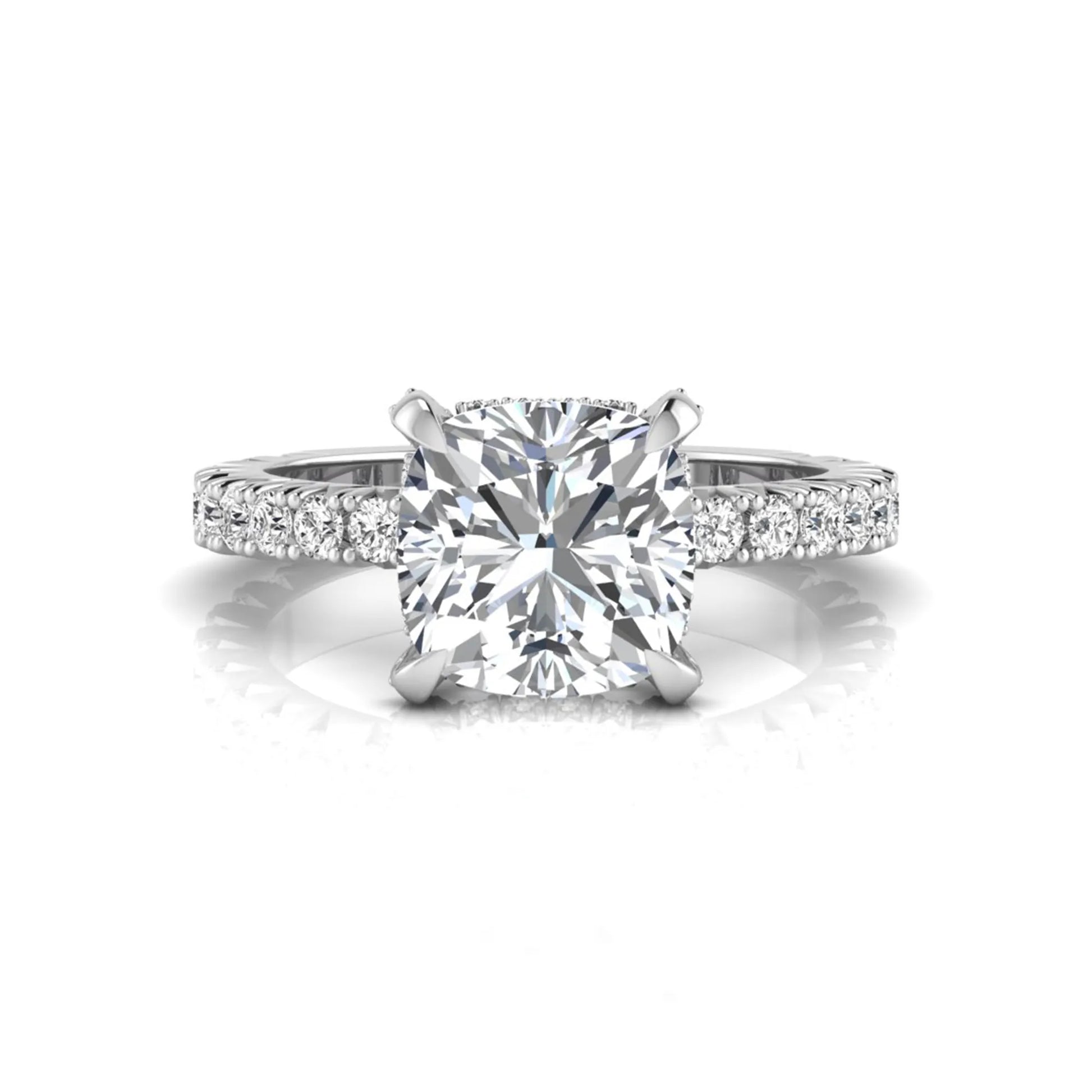 Cushion cut lab grown diamond engagement ring featuring a four-prong setting with round pavé side diamonds and white gold tone band.