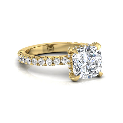 Cushion cut lab grown diamond engagement ring featuring a four-prong setting with round pavé side diamonds and yellow gold tone band.