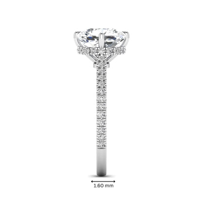 Cushion cut lab grown diamond hidden halo engagement ring featuring a 2.75 carat IGI certified center diamond with a pavé diamond band in white gold.