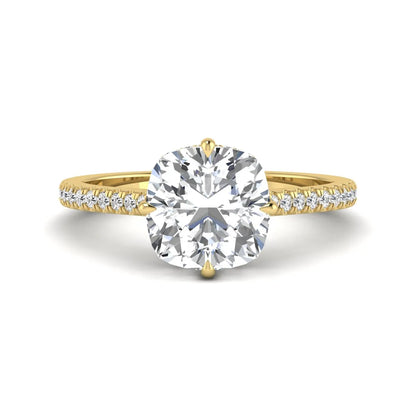 Cushion cut lab grown diamond hidden halo engagement ring featuring a 2.75 carat IGI certified center diamond with a pavé diamond band in yellow gold.