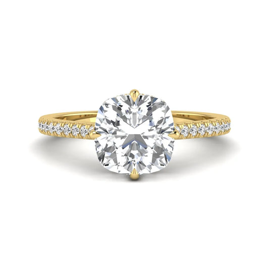 Cushion cut lab grown diamond hidden halo engagement ring featuring a 2.75 carat IGI certified center diamond with a pavé diamond band in yellow gold.