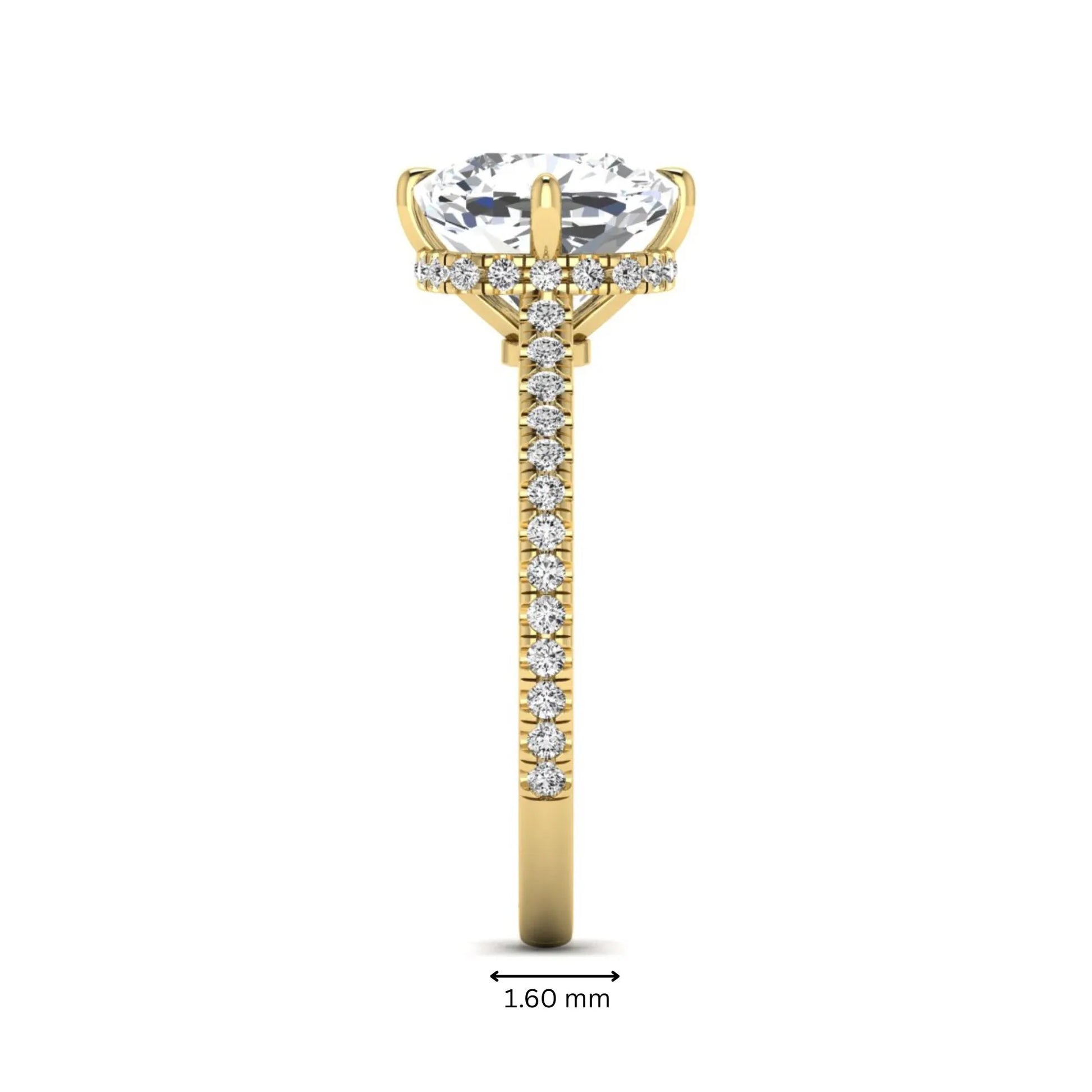 Cushion cut lab grown diamond hidden halo engagement ring featuring a 2.75 carat IGI certified center diamond with a pavé diamond band in yellow gold.
