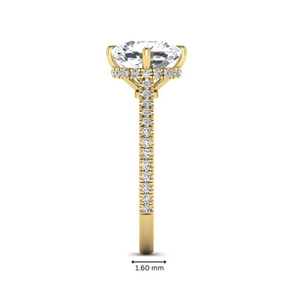 Cushion cut lab grown diamond hidden halo engagement ring featuring a 2.75 carat IGI certified center diamond with a pavé diamond band in yellow gold.
