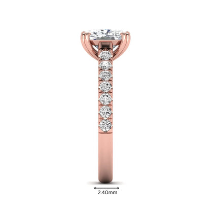 IGI certified cushion cut lab grown diamond solitaire accent engagement ring with pavé round diamond band in rose gold.
