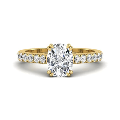 IGI certified cushion cut lab grown diamond solitaire accent engagement ring with pavé round diamond band in yellow gold.