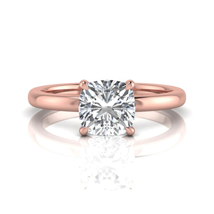 Cushion cut lab grown diamond solitaire engagement ring featuring a 1.28 carat IGI certified center diamond in a classic four-prong setting in rose gold