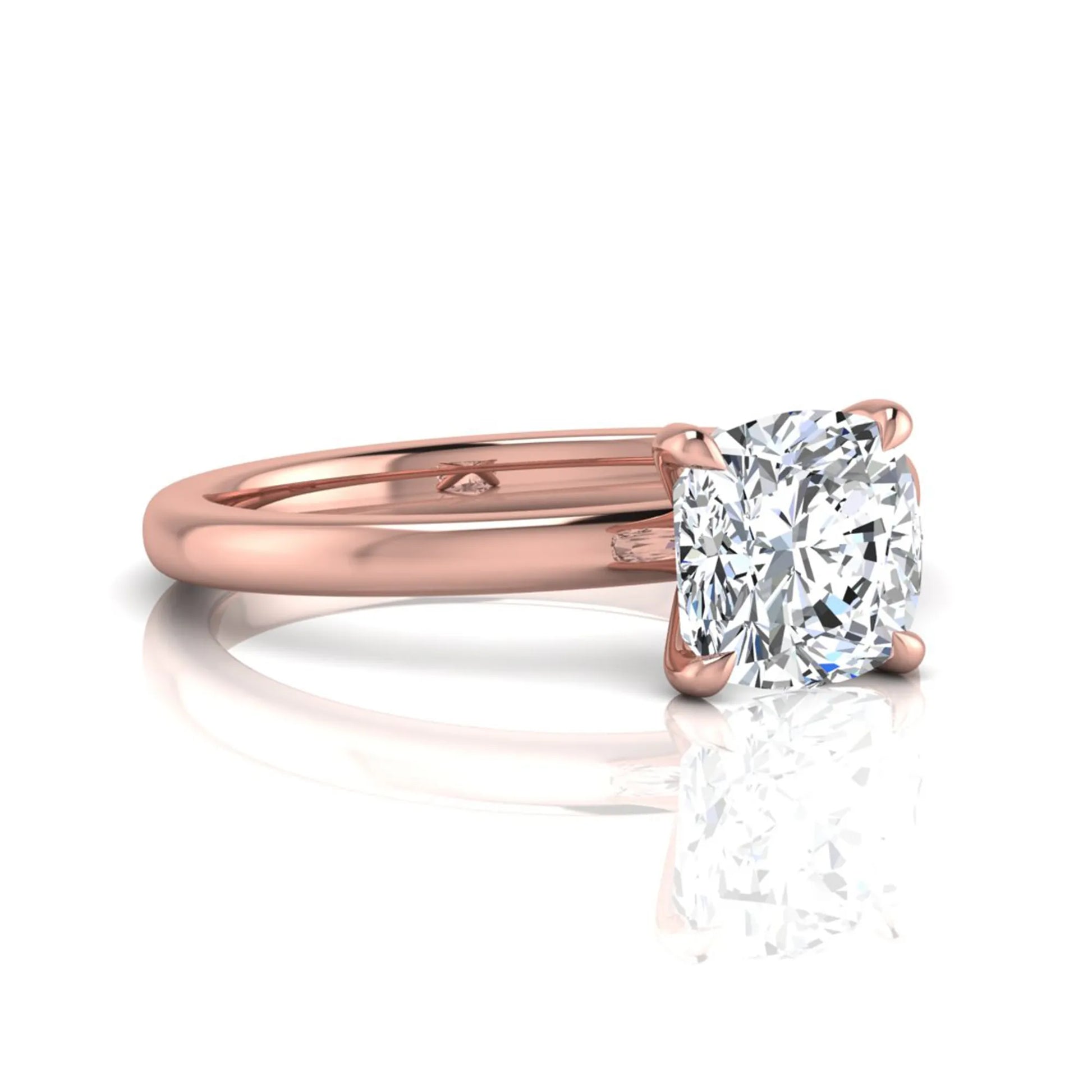 Cushion cut lab grown diamond solitaire engagement ring featuring a 1.28 carat IGI certified center diamond in a classic four-prong setting in rose gold