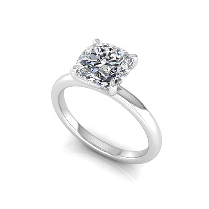 Cushion cut lab grown diamond solitaire engagement ring featuring a 1.28 carat IGI certified center diamond in a classic four-prong setting in white gold