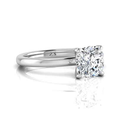 Cushion cut lab grown diamond solitaire engagement ring featuring a 1.28 carat IGI certified center diamond in a classic four-prong setting in white gold