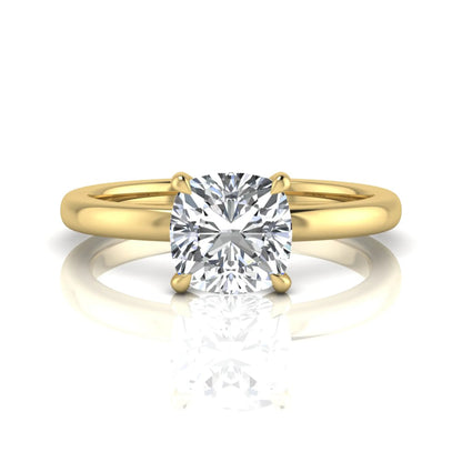 Cushion cut lab grown diamond solitaire engagement ring featuring a 1.28 carat IGI certified center diamond in a classic four-prong setting in yellow gold