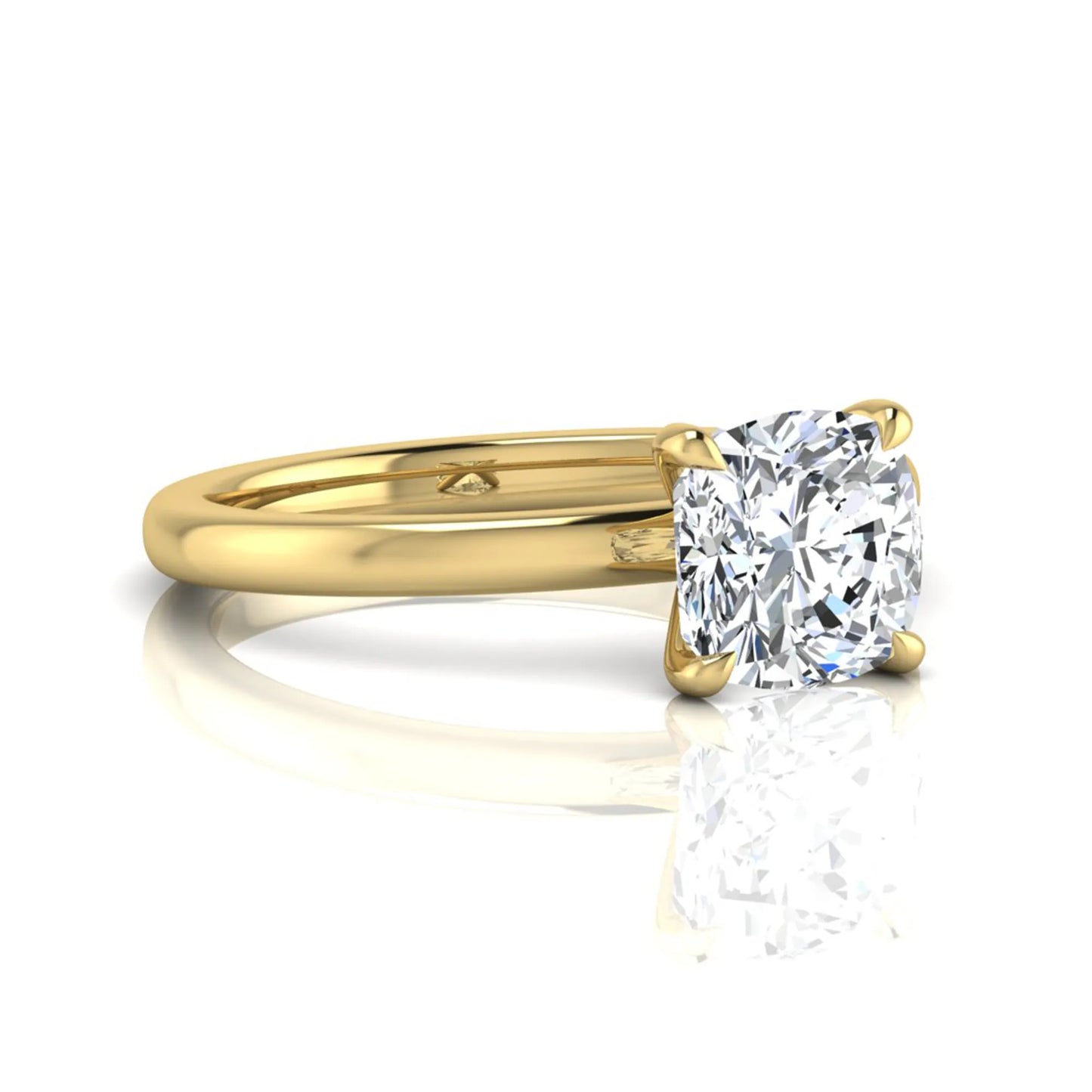 Cushion cut lab grown diamond solitaire engagement ring featuring a 1.28 carat IGI certified center diamond in a classic four-prong setting in yellow gold