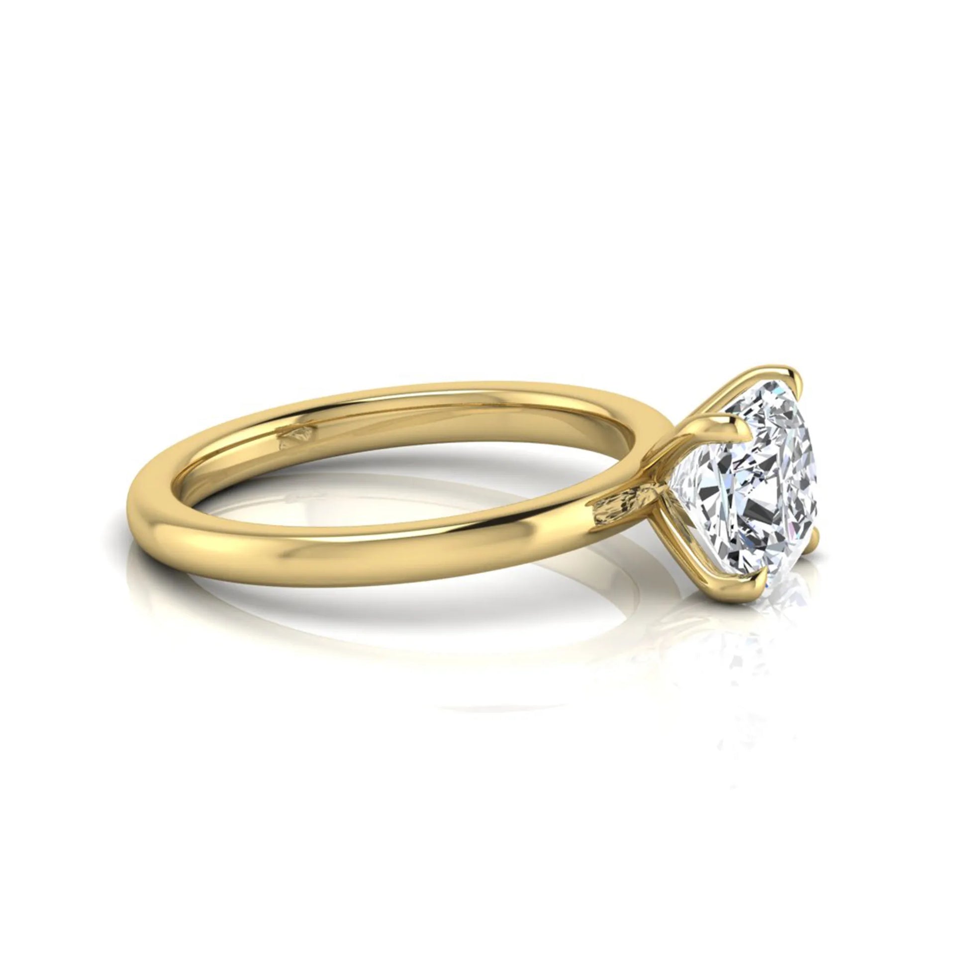 Cushion cut lab grown diamond solitaire engagement ring featuring a 1.28 carat IGI certified center diamond in a classic four-prong setting in yellow gold