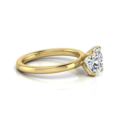 Cushion cut lab grown diamond solitaire engagement ring featuring a 1.28 carat IGI certified center diamond in a classic four-prong setting in yellow gold