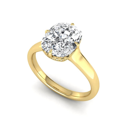 IGI certified cushion cut lab grown diamond solitaire engagement ring with hidden halo in yellow gold.