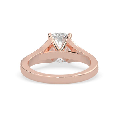 Rose gold ring with a lab grown  diamond on a white background