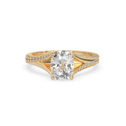 yellow Gold ring with a large diamond and smaller diamonds on the band against a white background